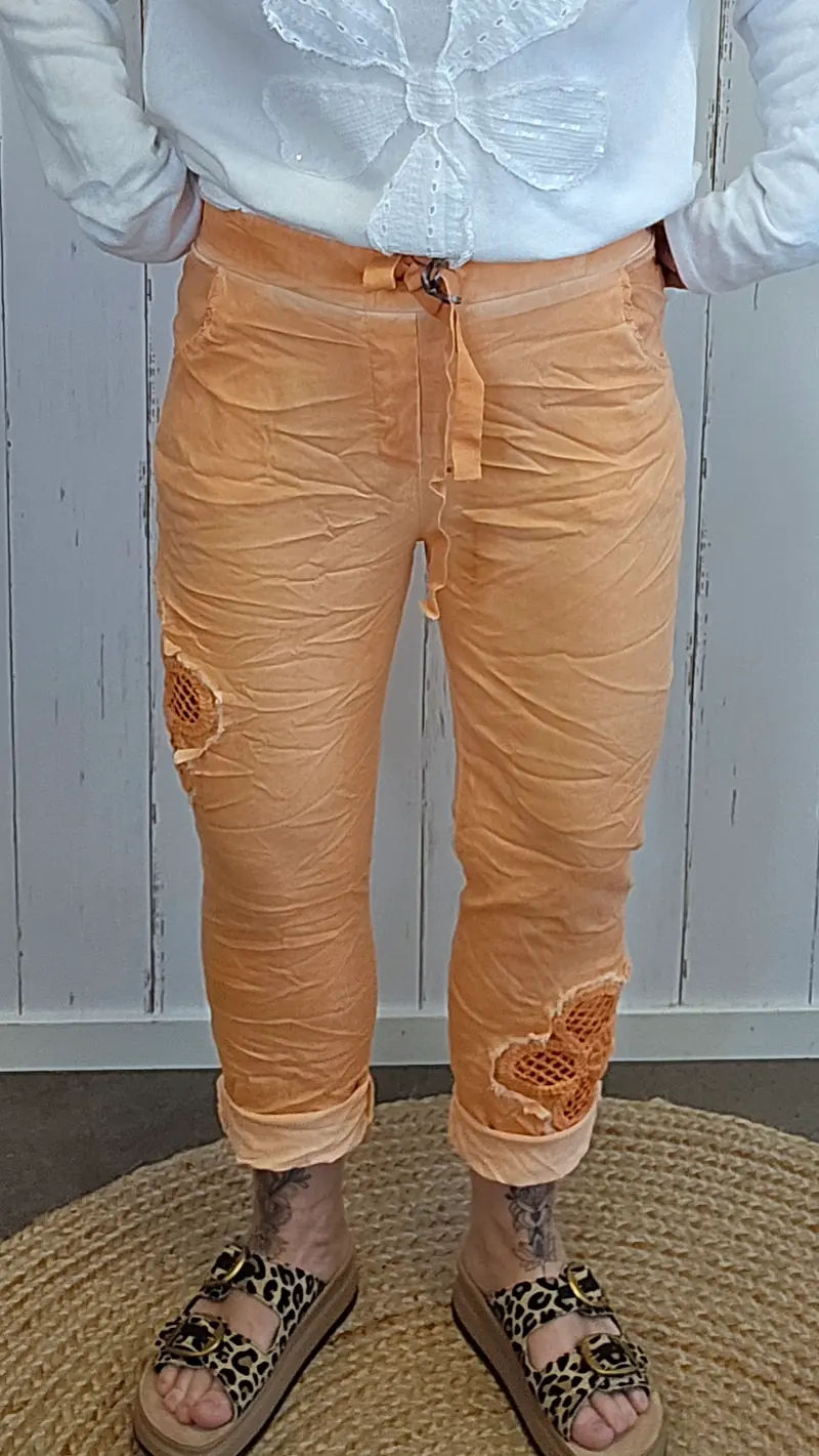 Alma bukse med blomst orange