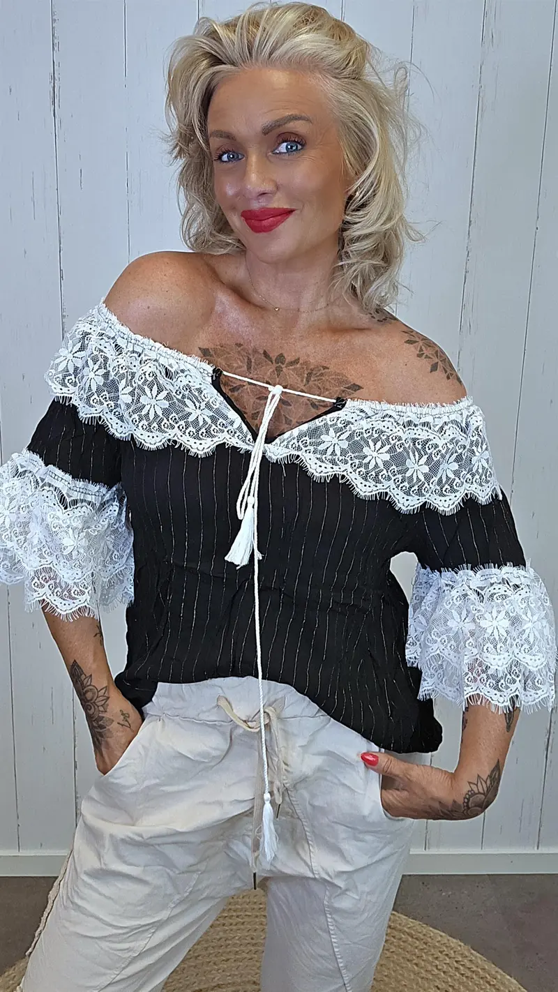 Bluse med blonder svart